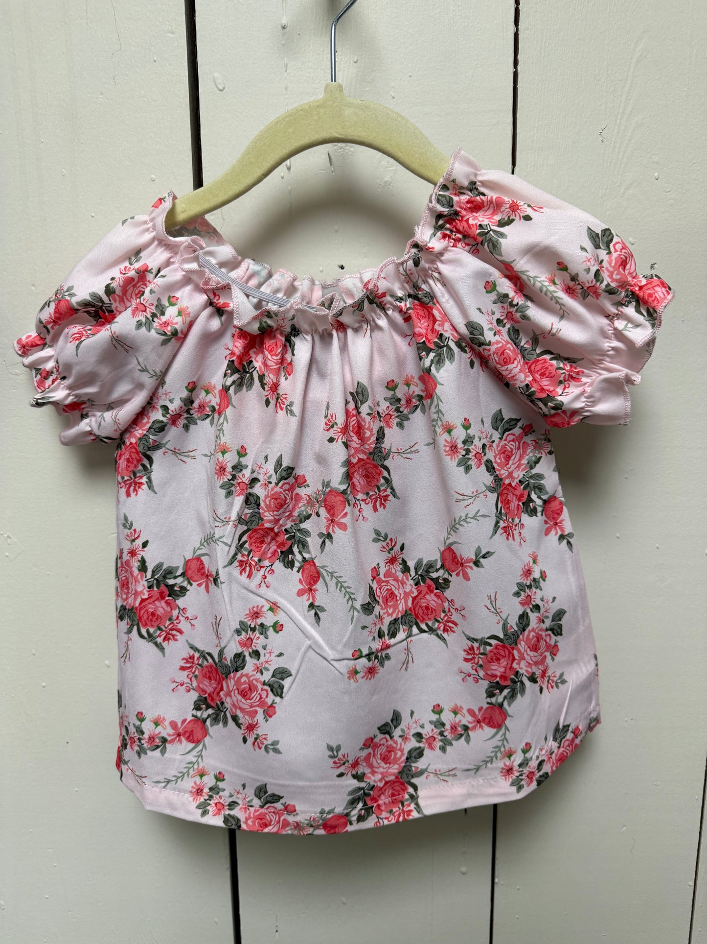 pink rose shirt with black bow shorts