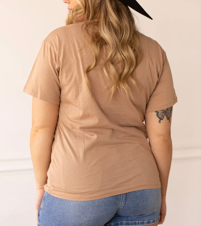 pink ring skeleton hand tan shirt
