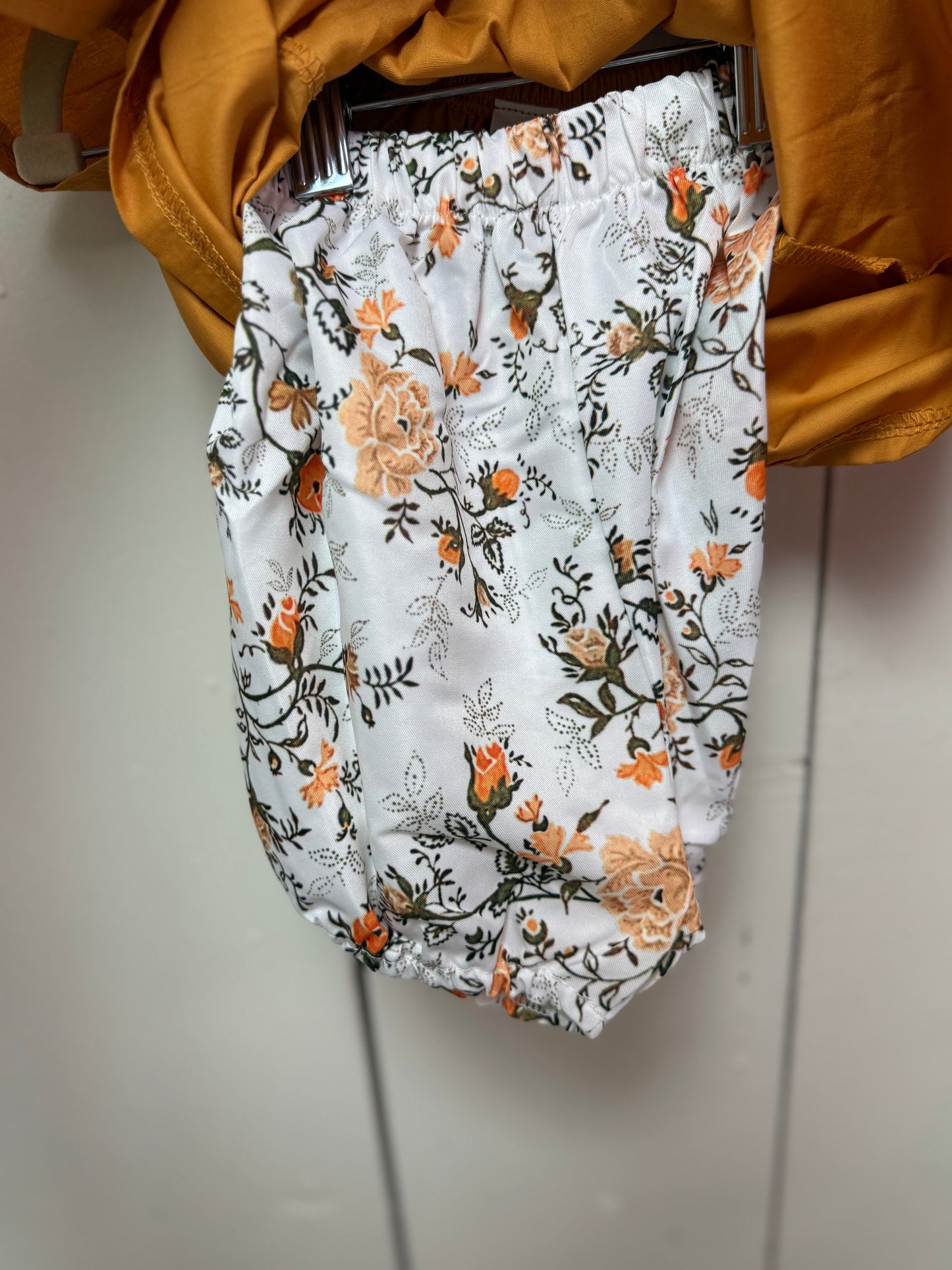 yellow shirt with flower bloomers