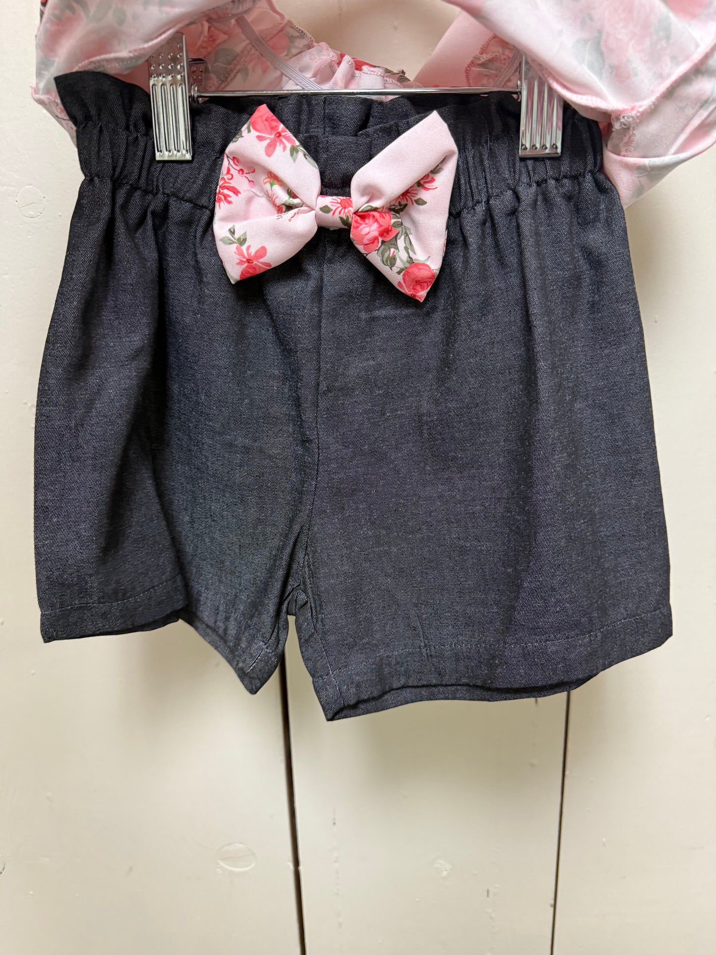 pink rose shirt with black bow shorts
