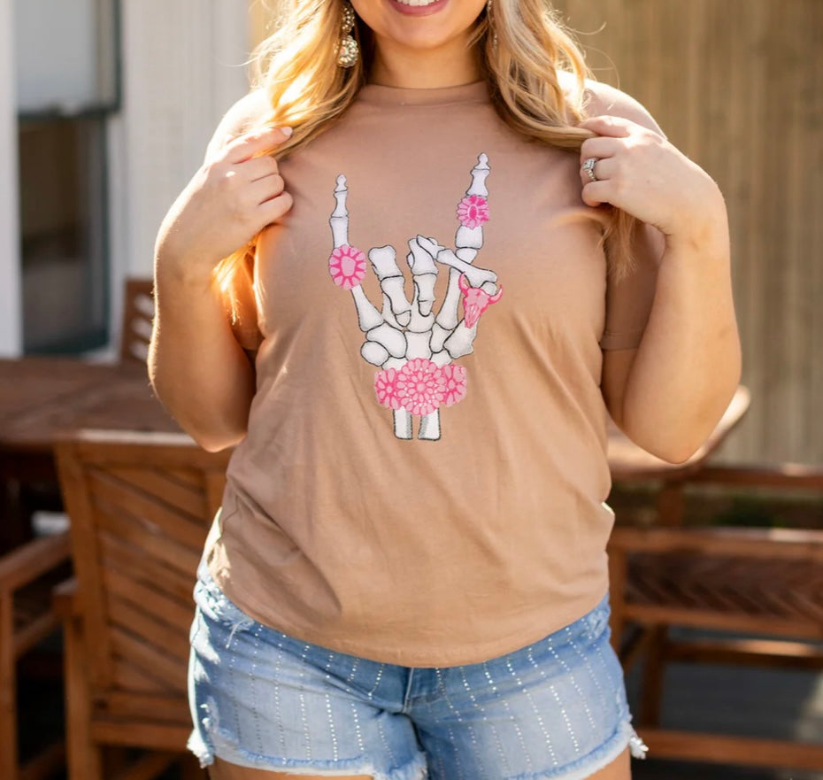 pink ring skeleton hand tan shirt