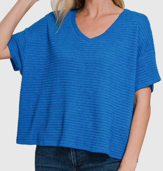 bright blue off shoulder knit top